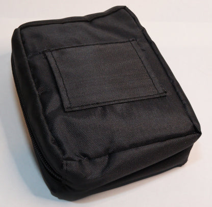 A black fabric utility pouch with a rectangular patch pocket on the front, photographed on a plain white background.